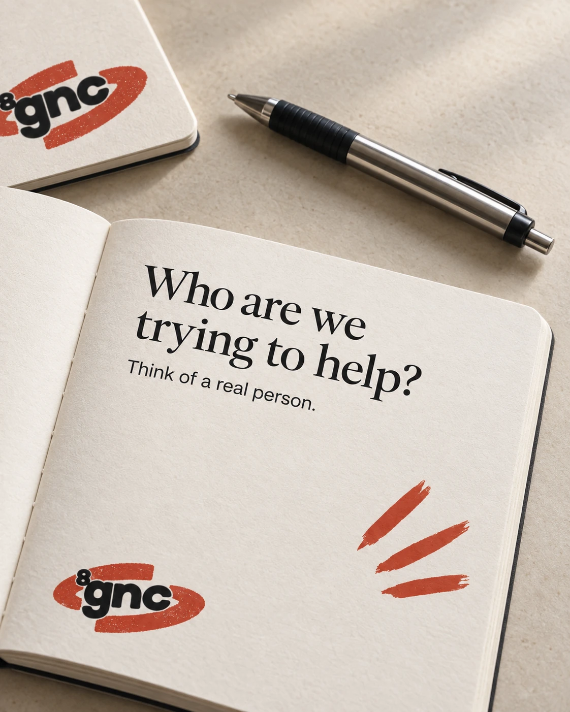 8gnc notebook, pen and editorial zine on a work surface.