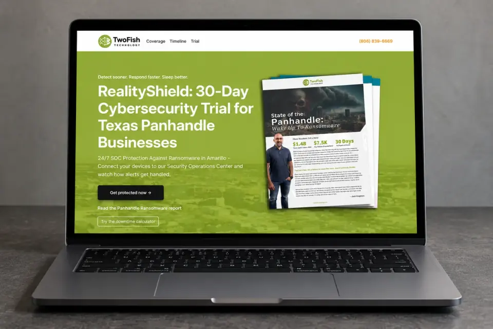 RealityShield / authored landing page on laptop for Two Fish Technology.